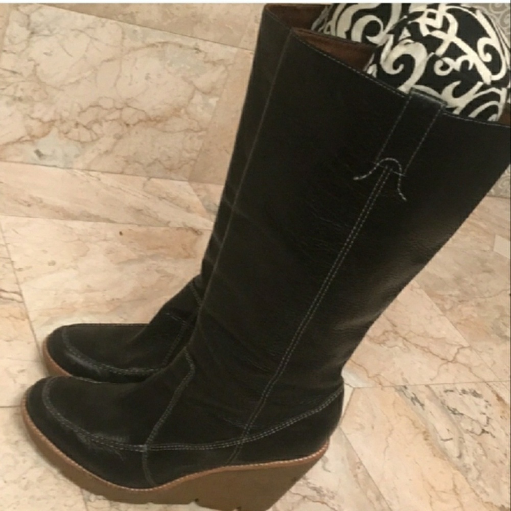 Michael Kors boots with a wedge heel.